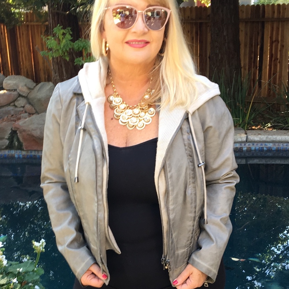 Get faux leather jacket with sweater hood.